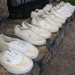 8 pairs of beat up white on white vans